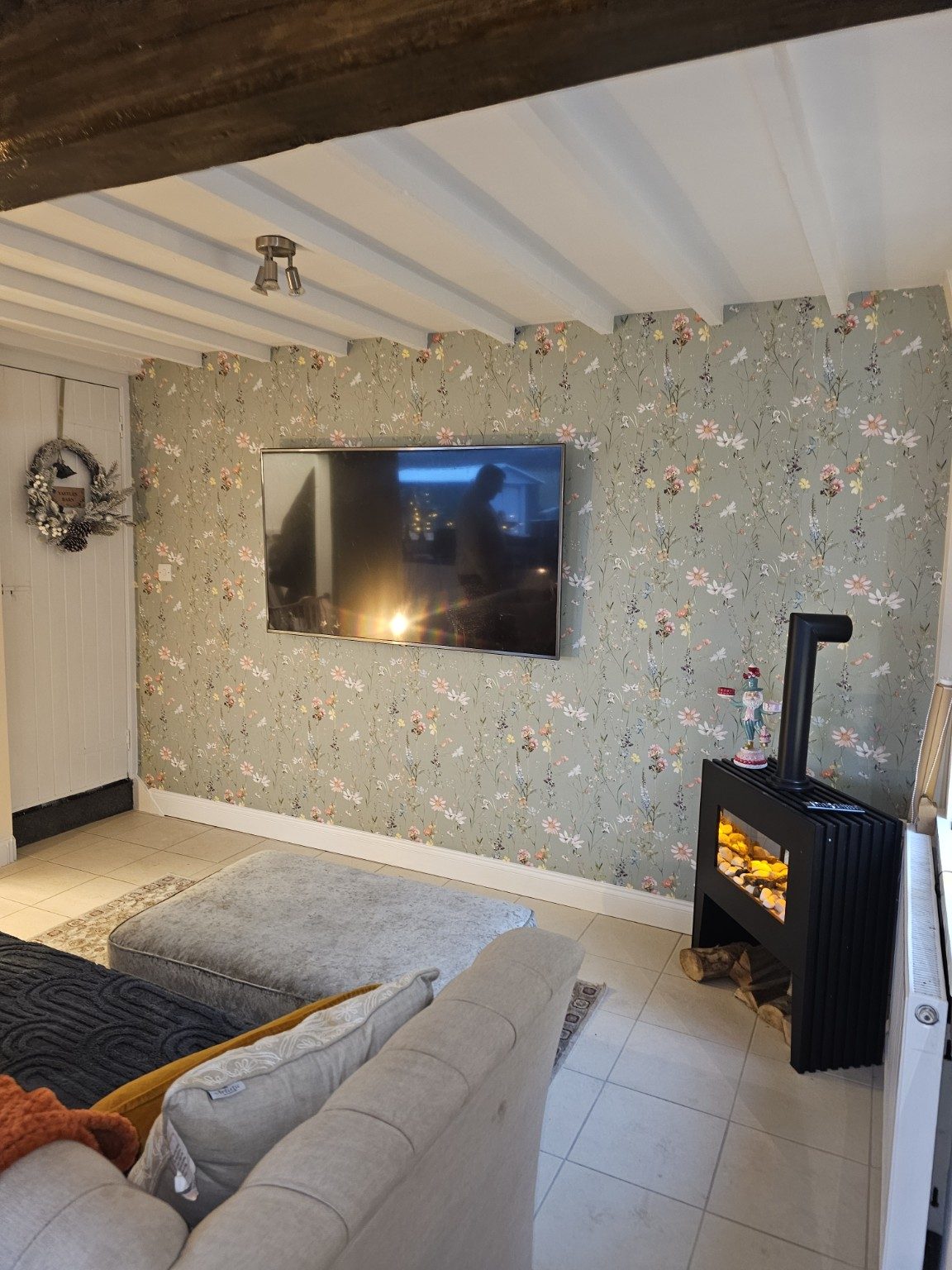 Cosy Yaffles Barn lounge with fire and television