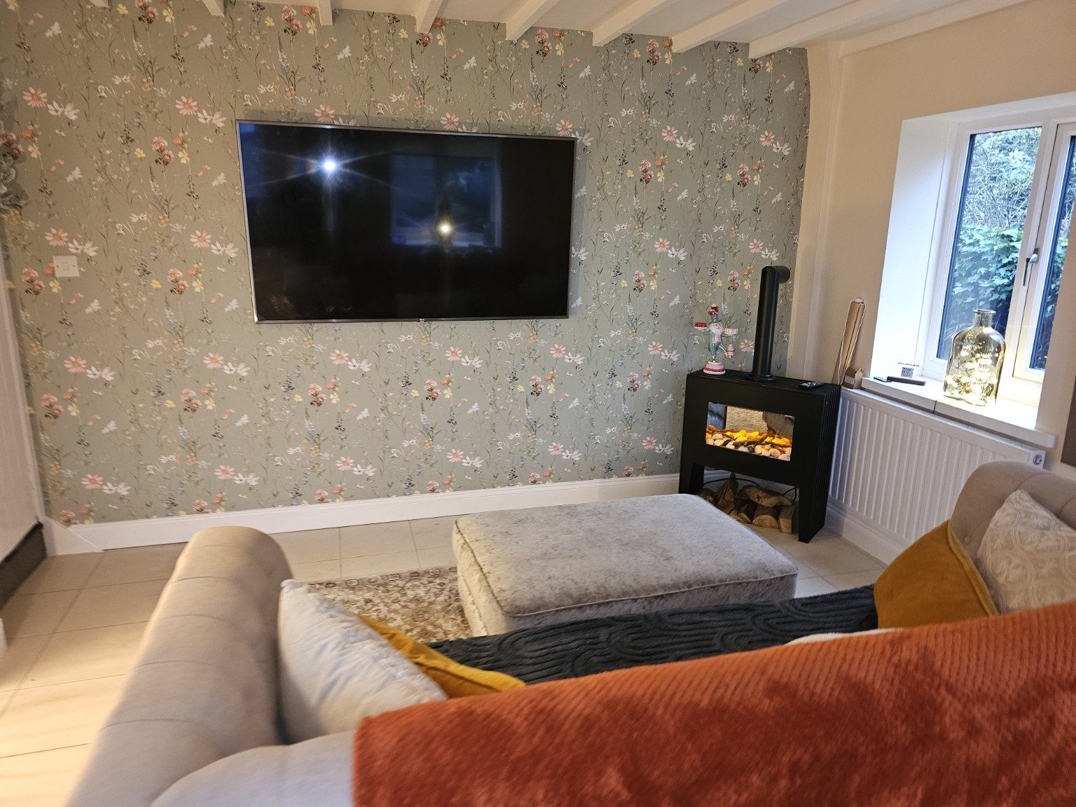 Yaffles Barn cosy lounge with television and feature fire